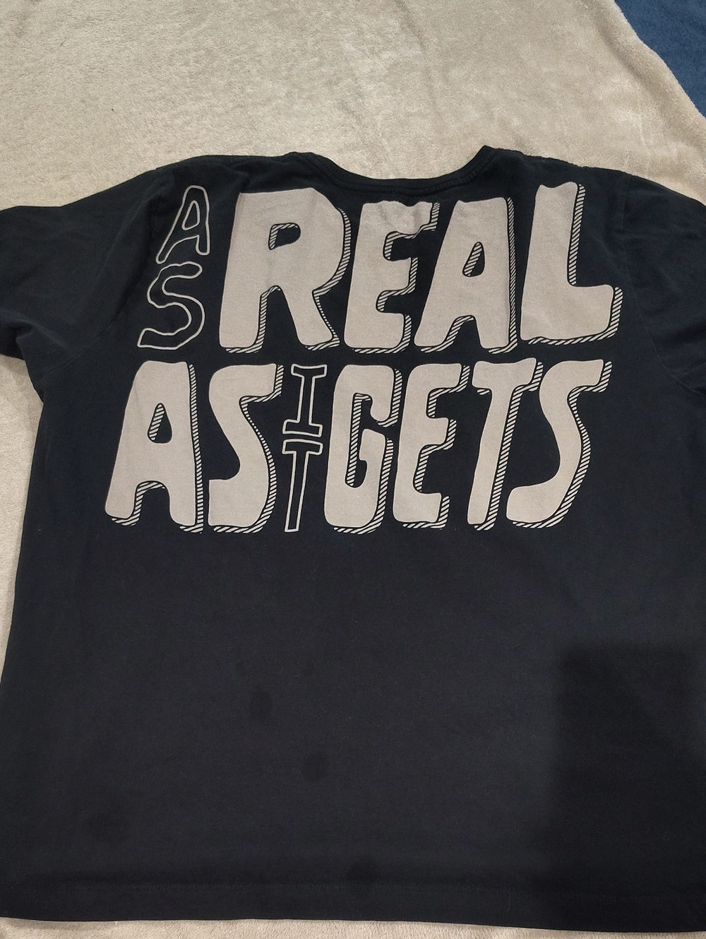 Loomstate Black Tee with White 'REAL AS IT GETS' Graphic